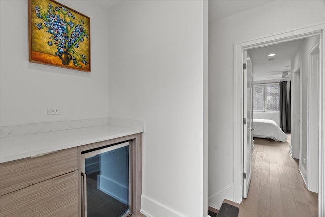 6223 S Ellis Ave, Chicago, IL 60637 - hallway with wine cooler, wood finished floors, and recessed lighting