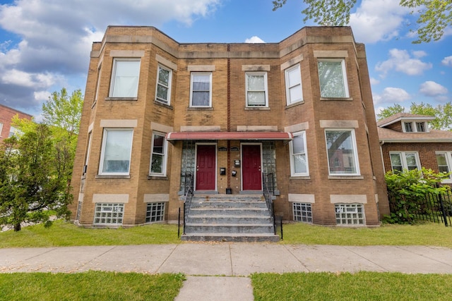 6601 S St Lawrence Ave, Chicago, IL 60637 - view of front facade with brick siding and a front yard