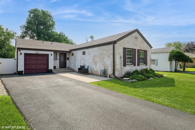247 Tioga Ave, Bensenville, IL 60106 - ranch-style home featuring a garage, asphalt driveway, brick siding, and roof with shingles