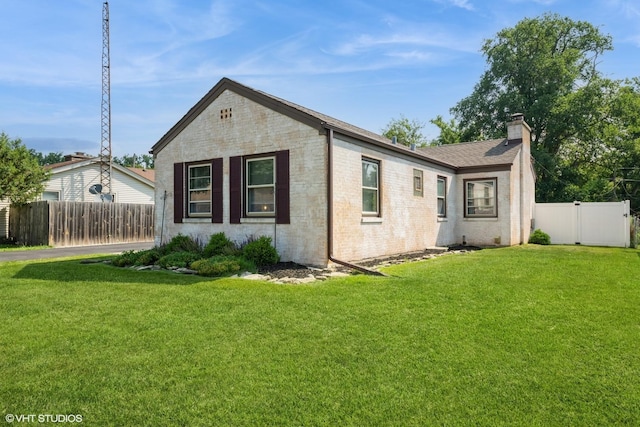 247 Tioga Ave, Bensenville, IL 60106 - view of property exterior with a chimney and brick siding