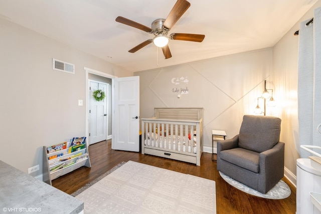 247 Tioga Ave, Bensenville, IL 60106 - bedroom with wood finished floors, a crib, and a ceiling fan