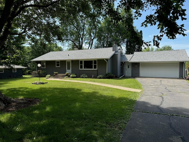 1536 Marberly Dr, Rockford, IL 61103 - single story home featuring an attached garage, a chimney, driveway, and a front yard