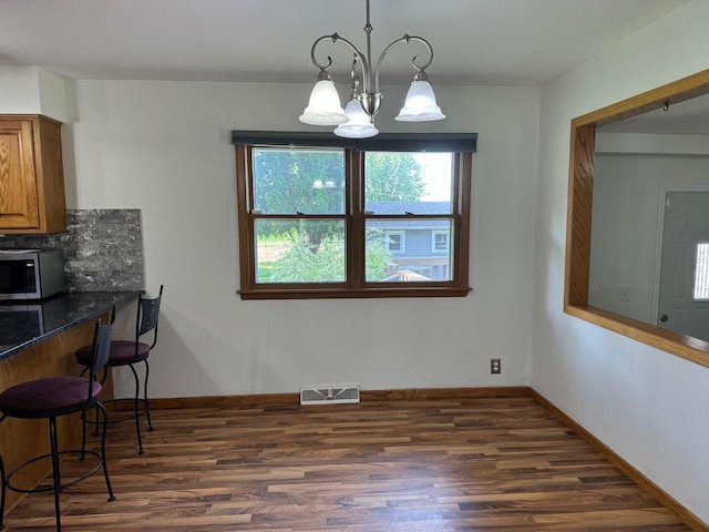 1536 Marberly Dr, Rockford, IL 61103 - dining area with dark wood finished floors and healthy amount of natural light