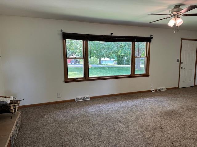 1536 Marberly Dr, Rockford, IL 61103 - unfurnished living room with carpet floors and ceiling fan
