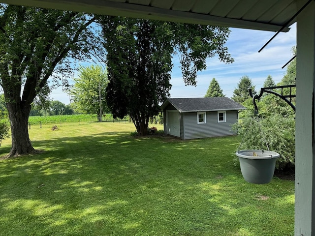 1536 Marberly Dr, Rockford, IL 61103 - view of grassy yard featuring an outbuilding and a garage