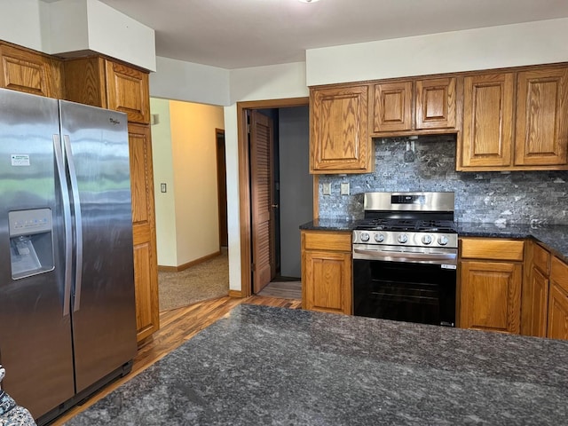1536 Marberly Dr, Rockford, IL 61103 - kitchen with stainless steel appliances, brown cabinets, wood finished floors, and backsplash