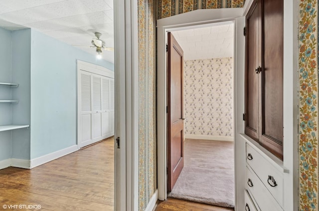 3900 N Keeler Ave, Chicago, IL 60641 - hall with wallpapered walls and light wood-style floors