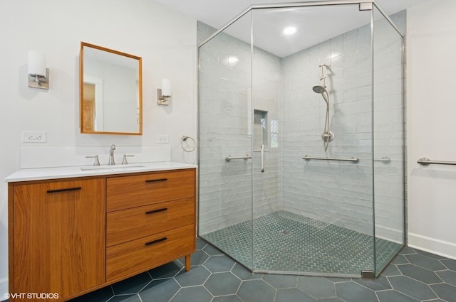 3900 N Keeler Ave, Chicago, IL 60641 - bathroom with a shower stall, vanity, and tile patterned floors