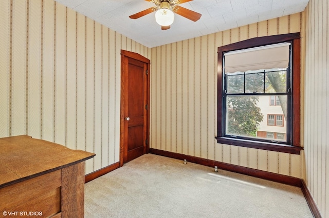 3900 N Keeler Ave, Chicago, IL 60641 - spare room with wallpapered walls, light colored carpet, and a ceiling fan