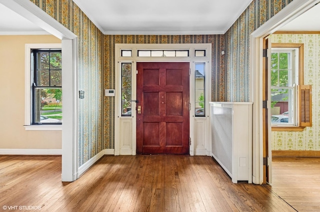 3900 N Keeler Ave, Chicago, IL 60641 - entrance foyer with wallpapered walls, hardwood / wood-style flooring, and ornamental molding