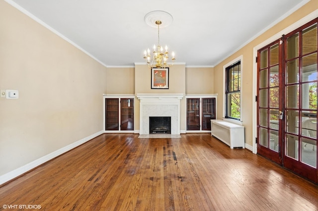 3900 N Keeler Ave, Chicago, IL 60641 - unfurnished living room featuring radiator heating unit, a chandelier, crown molding, hardwood / wood-style flooring, and a fireplace
