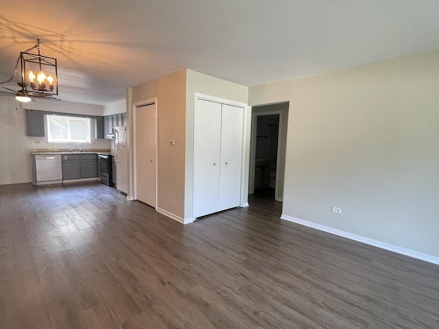 1208 Whispering Hills Ct Unit 1A, Naperville, IL 60540 - unfurnished living room featuring a chandelier and dark wood-style flooring