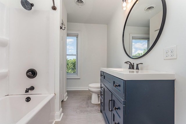141 E Lincoln St, Seneca, IL 61360 - full bath featuring vanity,  shower combination, and wood finished floors