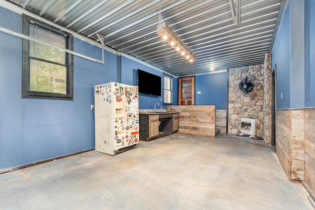 141 E Lincoln St, Seneca, IL 61360 - below grade area featuring white refrigerator with ice dispenser and a sink