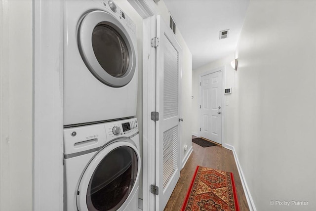 1124 W Diversey Pkwy Unit 2W, Chicago, IL 60614 - washroom featuring stacked washer and clothes dryer and wood finished floors