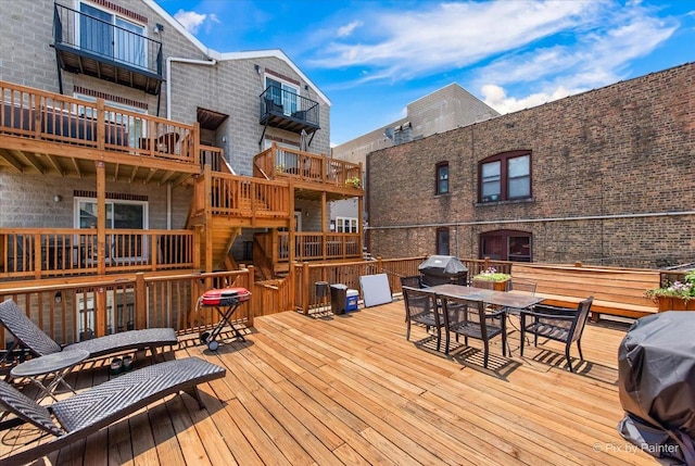 1124 W Diversey Pkwy Unit 2W, Chicago, IL 60614 - wooden terrace with area for grilling and outdoor dining area