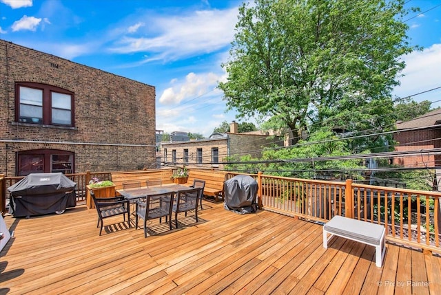 1124 W Diversey Pkwy Unit 2W, Chicago, IL 60614 - wooden terrace with area for grilling and outdoor dining space