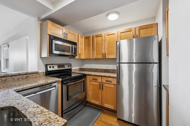 2909 N Sheridan Rd Unit 1309, Chicago, IL 60657 - kitchen with appliances with stainless steel finishes, light wood-style flooring, and light stone countertops