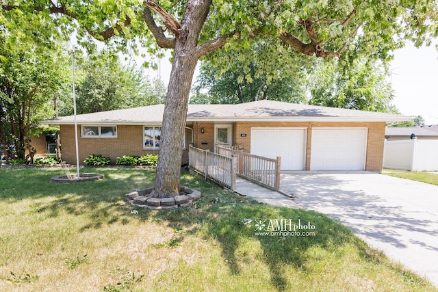680 S Center Ave, Bradley, IL 60915 - ranch-style home with an attached garage, concrete driveway, a front yard, and brick siding