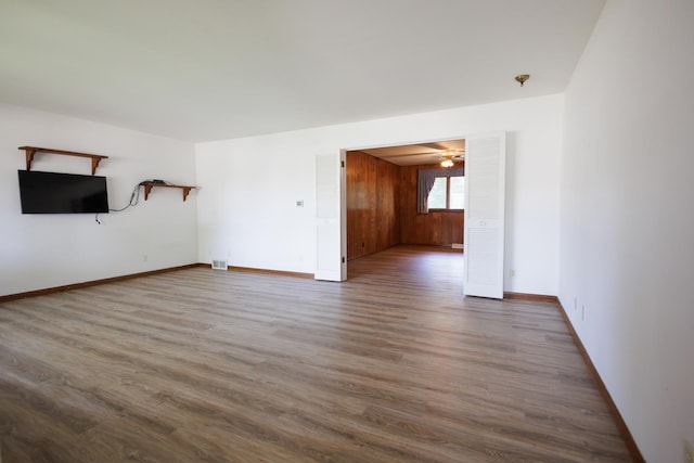 680 S Center Ave, Bradley, IL 60915 - unfurnished living room with wood finished floors and baseboards