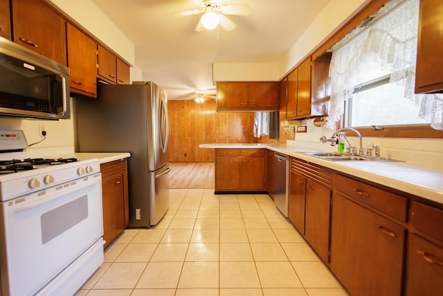 680 S Center Ave, Bradley, IL 60915 - kitchen with stainless steel appliances, ceiling fan, light countertops, a peninsula, and brown cabinetry