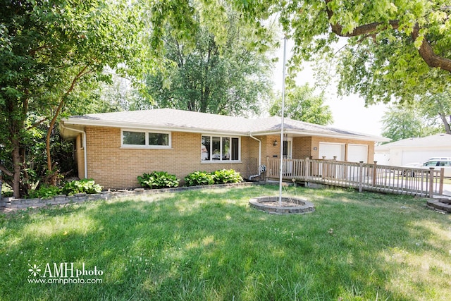 680 S Center Ave, Bradley, IL 60915 - ranch-style house featuring a garage, brick siding, a front lawn, and driveway
