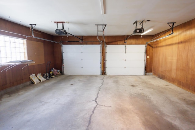 680 S Center Ave, Bradley, IL 60915 - garage with a garage door opener and wood walls