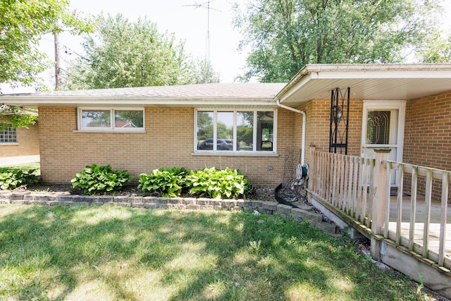 680 S Center Ave, Bradley, IL 60915 - single story home with brick siding and a front yard
