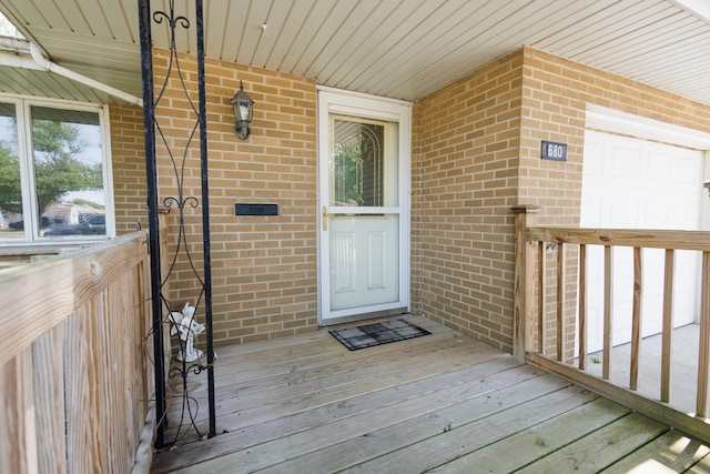 680 S Center Ave, Bradley, IL 60915 - view of exterior entry featuring brick siding and a garage