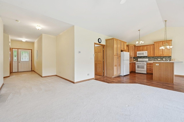 757 Bauman St Unit 0, Marengo, IL 60152 - kitchen with white appliances, a chandelier, light carpet, backsplash, and lofted ceiling