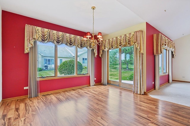 757 Bauman St Unit 0, Marengo, IL 60152 - unfurnished room featuring a chandelier and wood finished floors