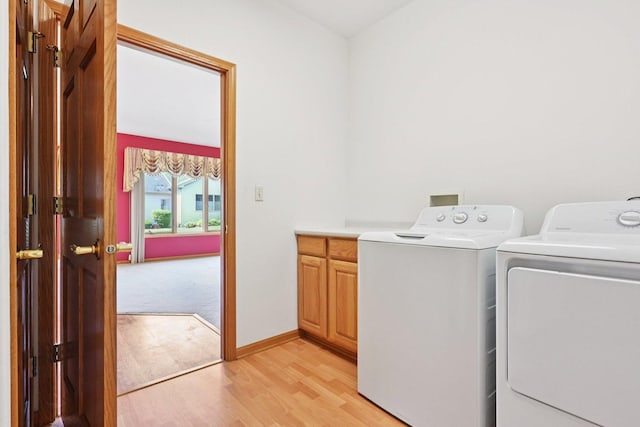 757 Bauman St Unit 0, Marengo, IL 60152 - laundry room with separate washer and dryer, cabinet space, and light wood finished floors
