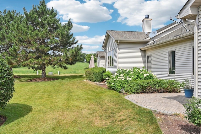 757 Bauman St Unit 0, Marengo, IL 60152 - view of green lawn featuring a patio area