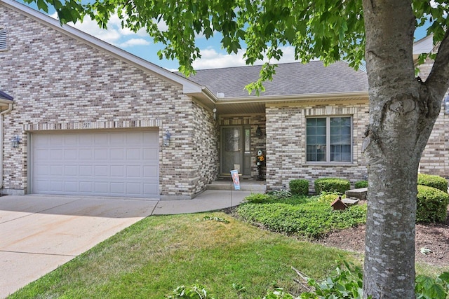 757 Bauman St Unit 0, Marengo, IL 60152 - single story home with brick siding, driveway, an attached garage, and a shingled roof