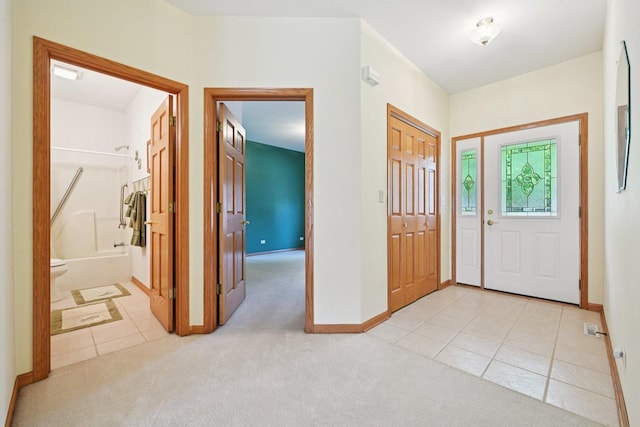 757 Bauman St Unit 0, Marengo, IL 60152 - entrance foyer with light tile patterned flooring and light colored carpet
