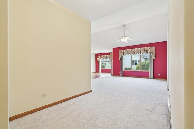 757 Bauman St Unit 0, Marengo, IL 60152 - spare room featuring carpet, a ceiling fan, lofted ceiling, and a chandelier