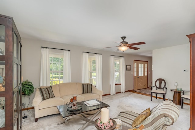 407 Anthony Ct, Oswego, IL 60543 - living area featuring plenty of natural light, light carpet, and a ceiling fan