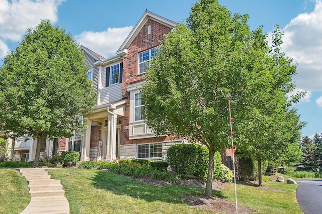 2903 Henley Ln, Naperville, IL 60540 - view of front of home with brick siding, a front yard, and stone siding