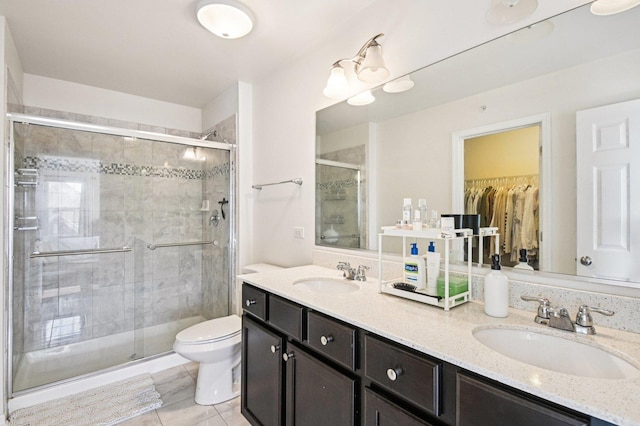 2903 Henley Ln, Naperville, IL 60540 - bathroom with double vanity, a shower stall, a walk in closet, and tile patterned floors