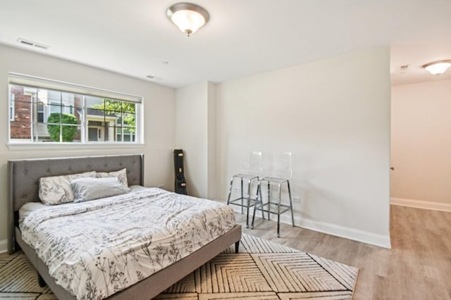 2903 Henley Ln, Naperville, IL 60540 - bedroom featuring wood finished floors and baseboards