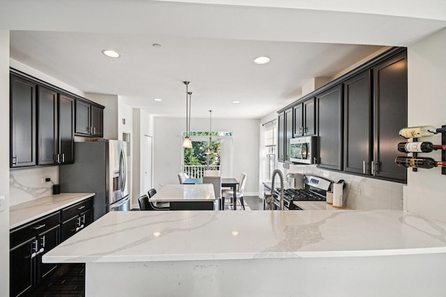 2903 Henley Ln, Naperville, IL 60540 - kitchen featuring stainless steel appliances, tasteful backsplash, recessed lighting, light stone countertops, and pendant lighting