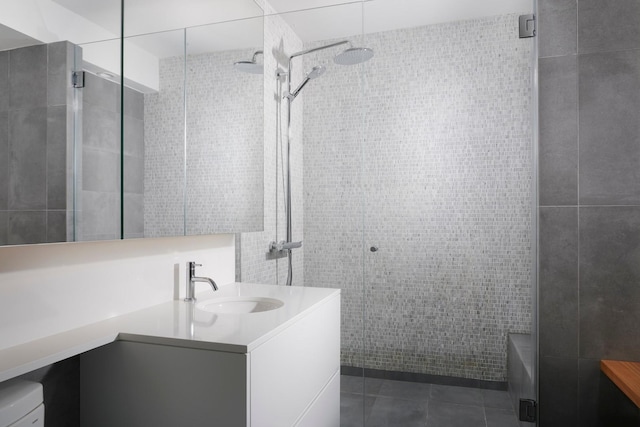 2 E Erie St Unit 2702, Chicago, IL 60611 - full bath featuring tile walls, vanity, a tile shower, and tile patterned floors