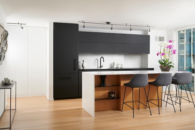2 E Erie St Unit 2702, Chicago, IL 60611 - bar featuring light wood-style flooring and track lighting