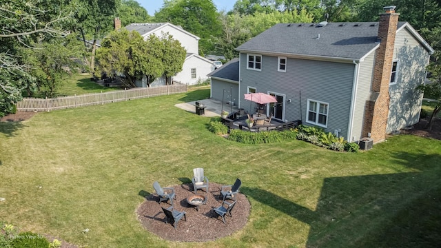 985 W Bauer Rd, Naperville, IL 60563 - back of property featuring an outdoor fire pit, a chimney, a wooden deck, roof with shingles, and a patio