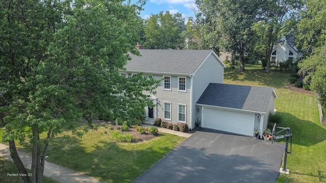 985 W Bauer Rd, Naperville, IL 60563 - colonial-style house featuring an attached garage, driveway, a front lawn, a shingled roof, and a chimney