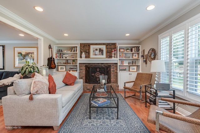 985 W Bauer Rd, Naperville, IL 60563 - living area featuring plenty of natural light, wood finished floors, recessed lighting, ornamental molding, and a brick fireplace