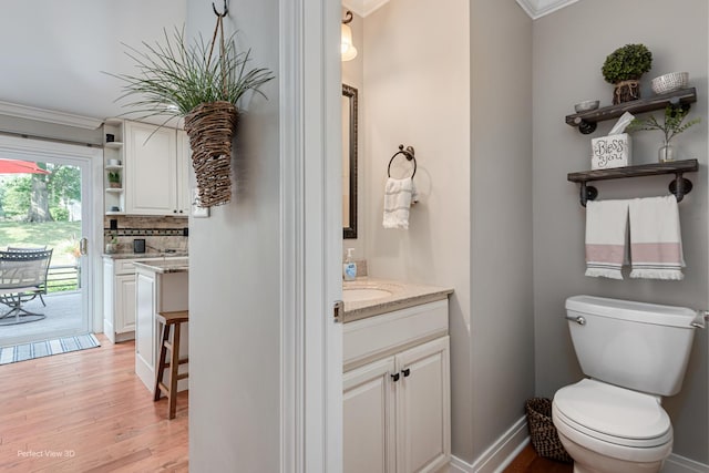 985 W Bauer Rd, Naperville, IL 60563 - full bathroom featuring vanity, ornamental molding, wood finished floors, and tasteful backsplash