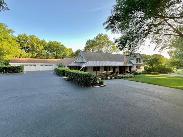 204 Country Commons Rd, Trout Valley, IL 60013 - view of front of property featuring covered porch, a front yard, a metal roof, and a chimney