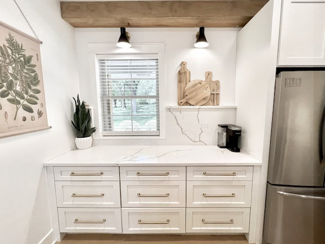 204 Country Commons Rd, Trout Valley, IL 60013 - kitchen with freestanding refrigerator, light stone counters, and white cabinets
