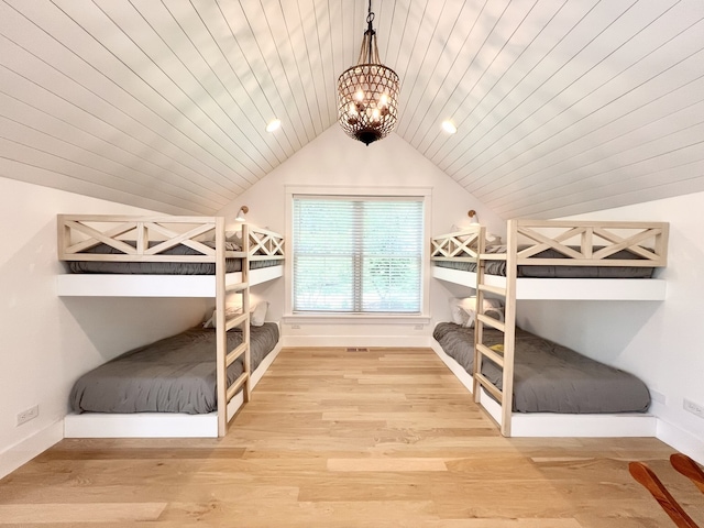 204 Country Commons Rd, Trout Valley, IL 60013 - bedroom with lofted ceiling, light wood-type flooring, and a chandelier